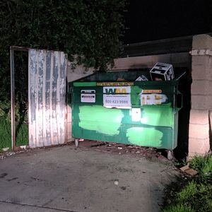 Green Dumpster at Night