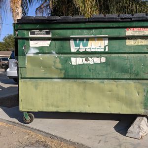Green Dumpster by Homes